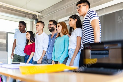 Preview: Young group of diverse of student friends posing together with teacher
