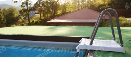 Preview: Outdoor swimming pool with clean water and ladder at resort