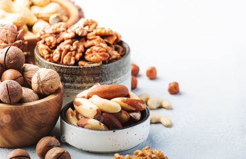 Preview: Nuts in bowls. Cashews, hazelnuts, walnuts, pecans, almonds and other
