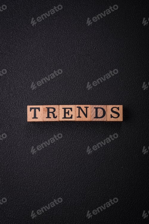 Preview: The inscription Trend made of wooden cubes on a plain background