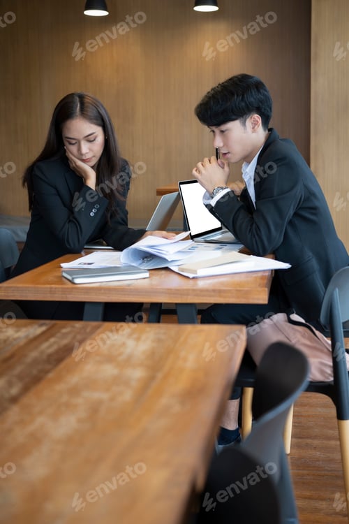 Preview: Group of human resources managers reading resume for selecting new employee.