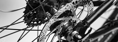 Preview: close-up shot of named mechanic brake disc on bicycle in black and white