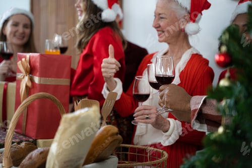 Preview: Family with Santa hats happy together in Christmas or xmas and new year celebration party.