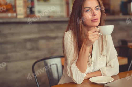 Preview: Young girl with a cup of coffee