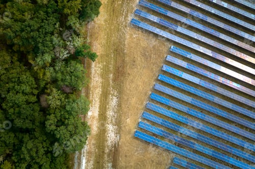 Preview: Aerial view of big sustainable electric power plant with many rows of solar photovoltaic panels