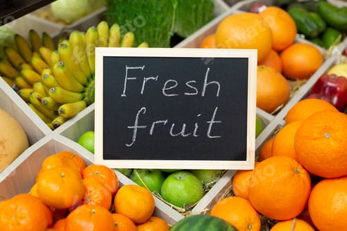Preview: Inscription in chalk fresh fruit on the sign in the vegetable store
