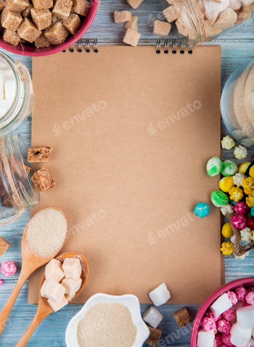 Preview: top view of a sketchbook with various types of sugar and candies in bowls and glass jars