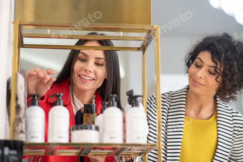 Preview: Two pretty women choosing body care products