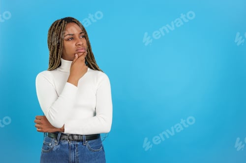 Preview: African beauty thoughtful woman standing and gesturing concern