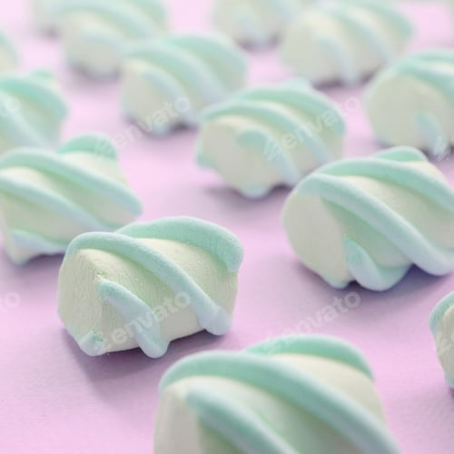 Preview: Colorful marshmallow laid out on pink paper background