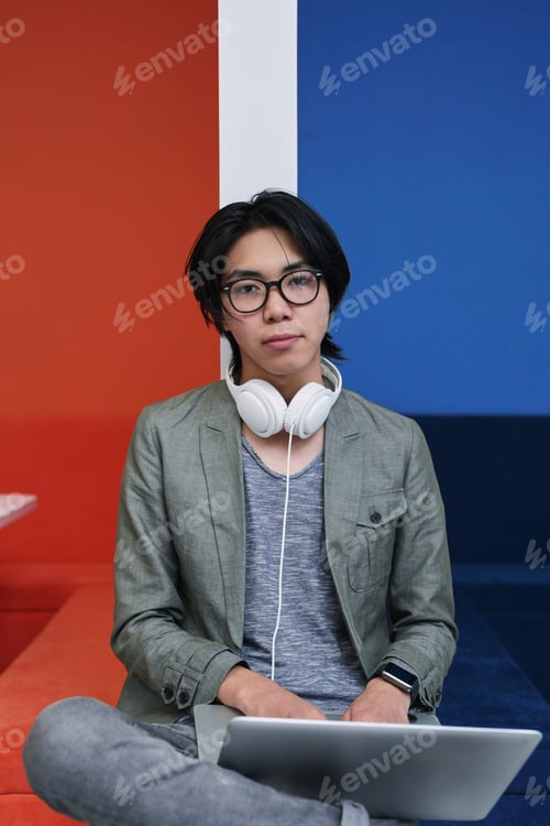 Preview: Asian teenager with laptop