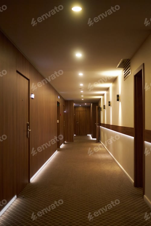 Preview: Illuminated Hotel Hallway with Modern Wooden Doors