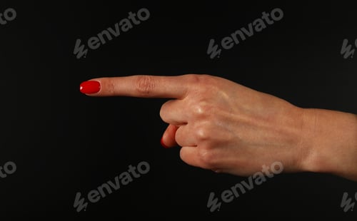 Preview: Woman hand pointing with index finger over black