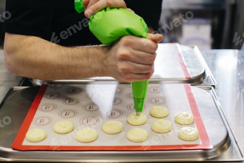 Preview: A confectioner makes macaroons in a pastry shop.