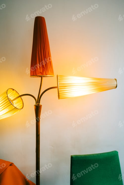 Preview: Vintage floor lamp near white wall.