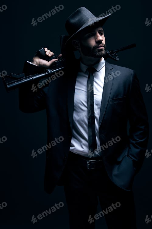 Preview: Hitman, suit or holding gun on studio background in dark secret spy, isolated mafia leadership or c