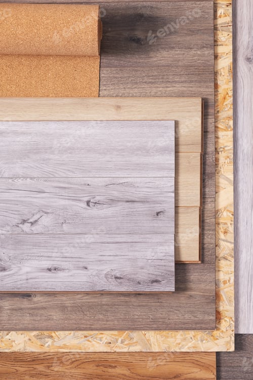 Preview: Laminate floor and cork roll on wood osb background texture. Wooden laminate floor and chipboard
