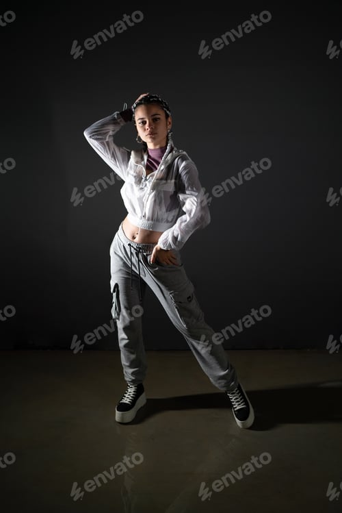 Preview: Young woman with urban style posing in studio shot