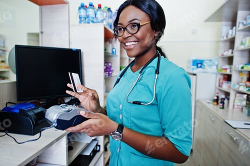 Preview: African american pharmacist working in drugstore