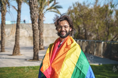 Preview: Positive man wrapped in LGBT flag
