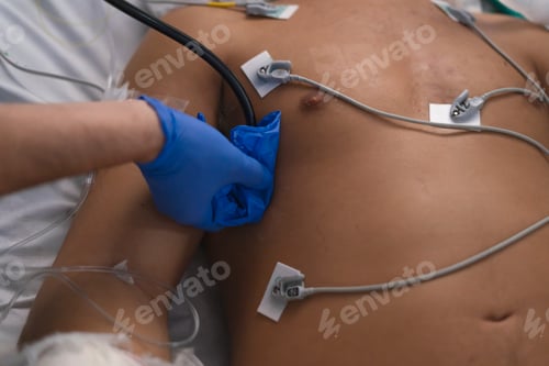 Preview: Medical professional attending patient with monitoring devices