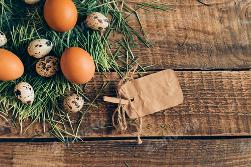 Preview: Straight from farm. Top view of eggs and brown paper label lying on wooden rustic table with grass