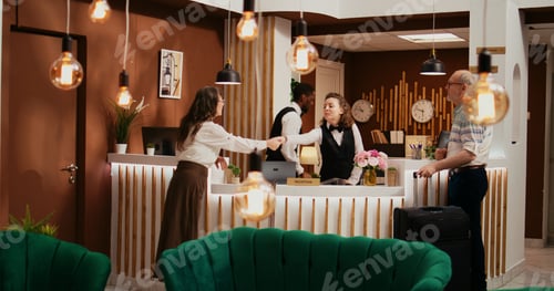 Preview: Hotel staff offering access key card