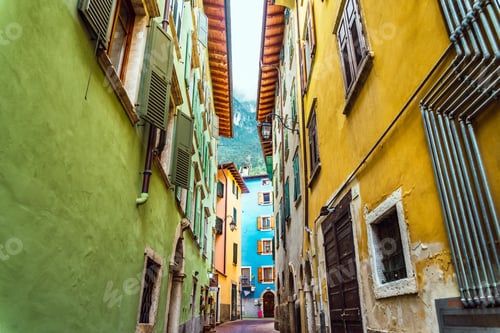 Preview: Narrow and colorful streets in a typical Italian village on the foothills of the mountains.