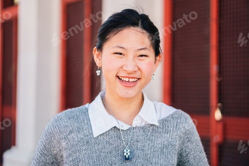 Preview: Close Up Portrait of happy Asian girl looking at camera. Chinese lady smiling and laughing outdoors