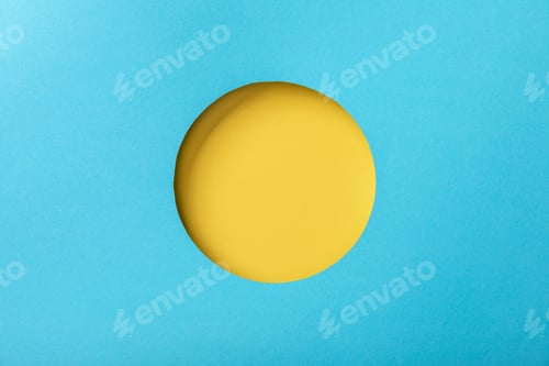 Preview: blue paper background with minimalistic yellow round hole