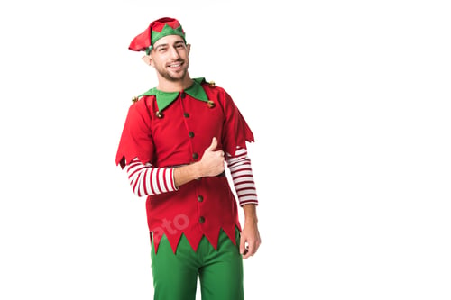 Preview: smiling man in christmas elf costume looking at camera and doing thumbs up sign isolated on white