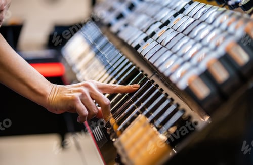 Preview: Customer woman choosing cosmetics in beauty store