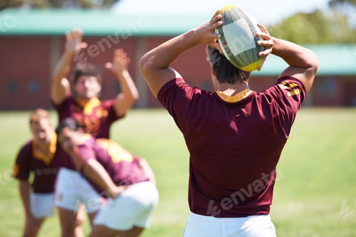 Preview: Pass the ball. Rearview shot of a young rugby player taking a lineout.