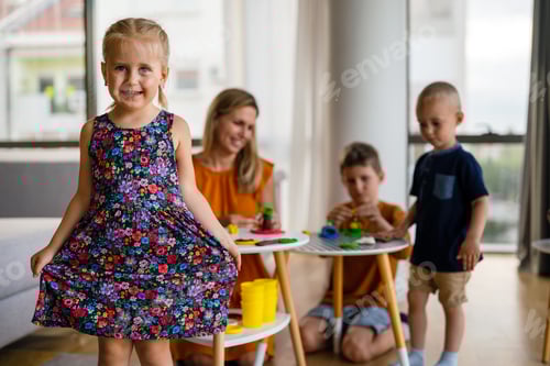 Preview: Child Smiles and Plays with Family at Home