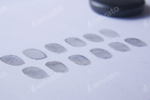 Preview: different black fingerprints on a paper close up ,