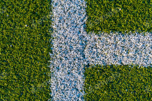 Preview: White lines on a green artificial football field