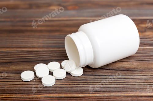 Preview: different drugs and health supplement pills poured from a medicine bottle health care