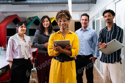 Preview: Startup business team posing in modern office with digital devices