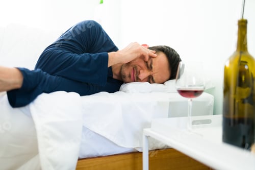Preview: Hispanic man waking up with a hangover