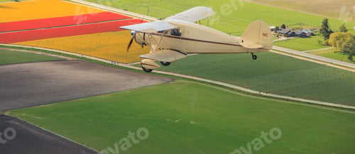 Preview: Biplane Flying Over Colorful Farm Fields, Rural Scenery