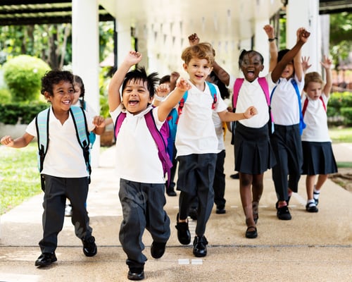 Preview: Group of diverse kindergarten students running cheerful after sc