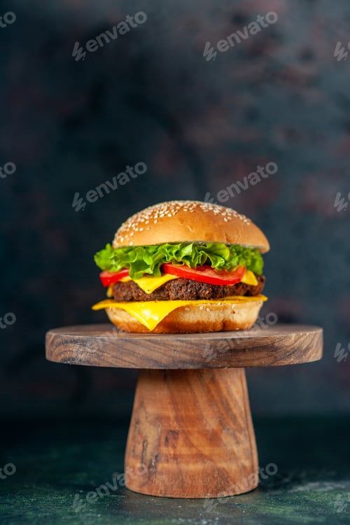 Preview: front view delicious meat hamburger with red tomatoes on dark background color fast-food french