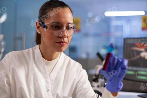 Preview: Medical researcher scientist analyzing blood jar
