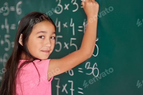 Preview: Girl making some exercises on the blackboard