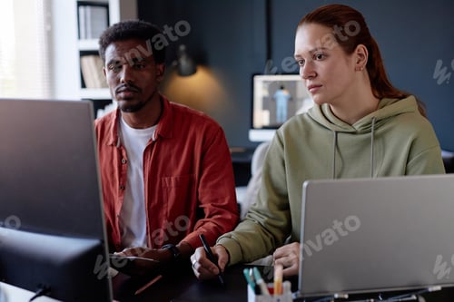 Preview: Working Together on Office Project in Modern Workspace
