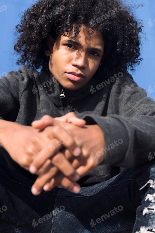 Preview: close up portrait of a curly haired male teenager