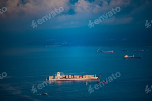 Preview: Aerial view of Cargo ship departing from Hong Kong's industrial port