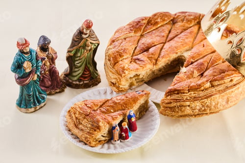 Preview: Epiphany cake on wooden table. Galette des rois traditional Epiphany cake in France