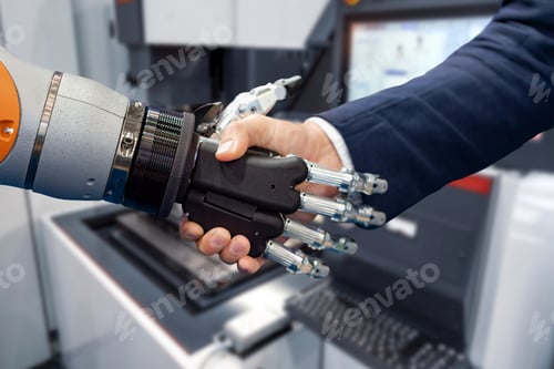 Preview: Hand of a businessman shaking hands with a Android robot.