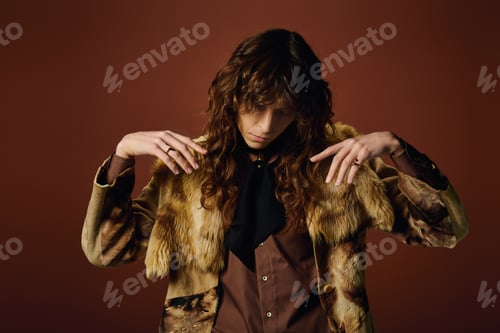 Preview: Stylish man showcasing high fashion with elegance in a vibrant studio setting